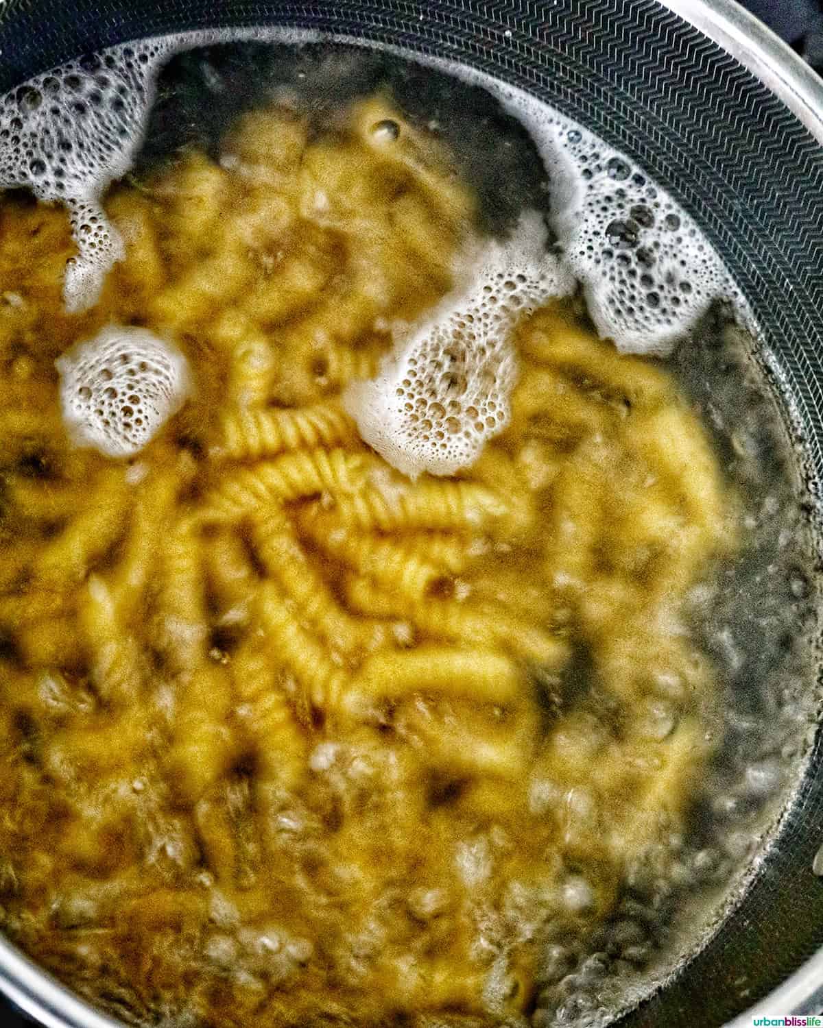 pasta boiling in a pot of water.