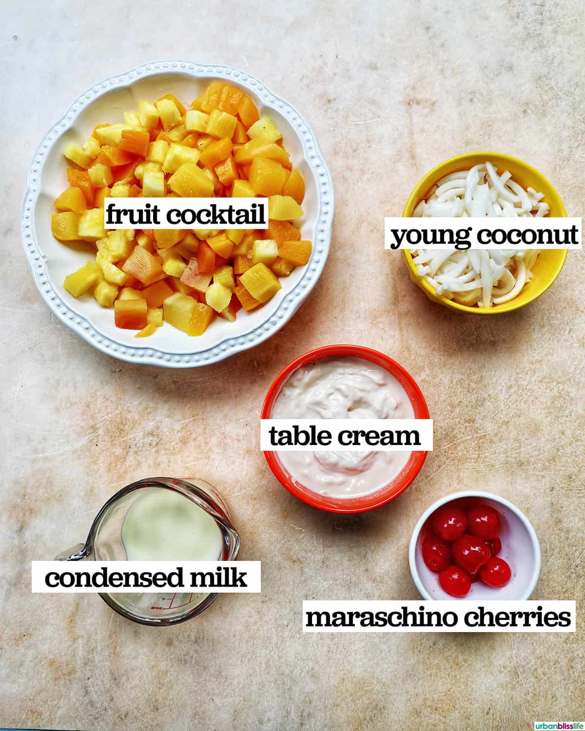 ingredients in bowls to make Filipino Fruit Salad.