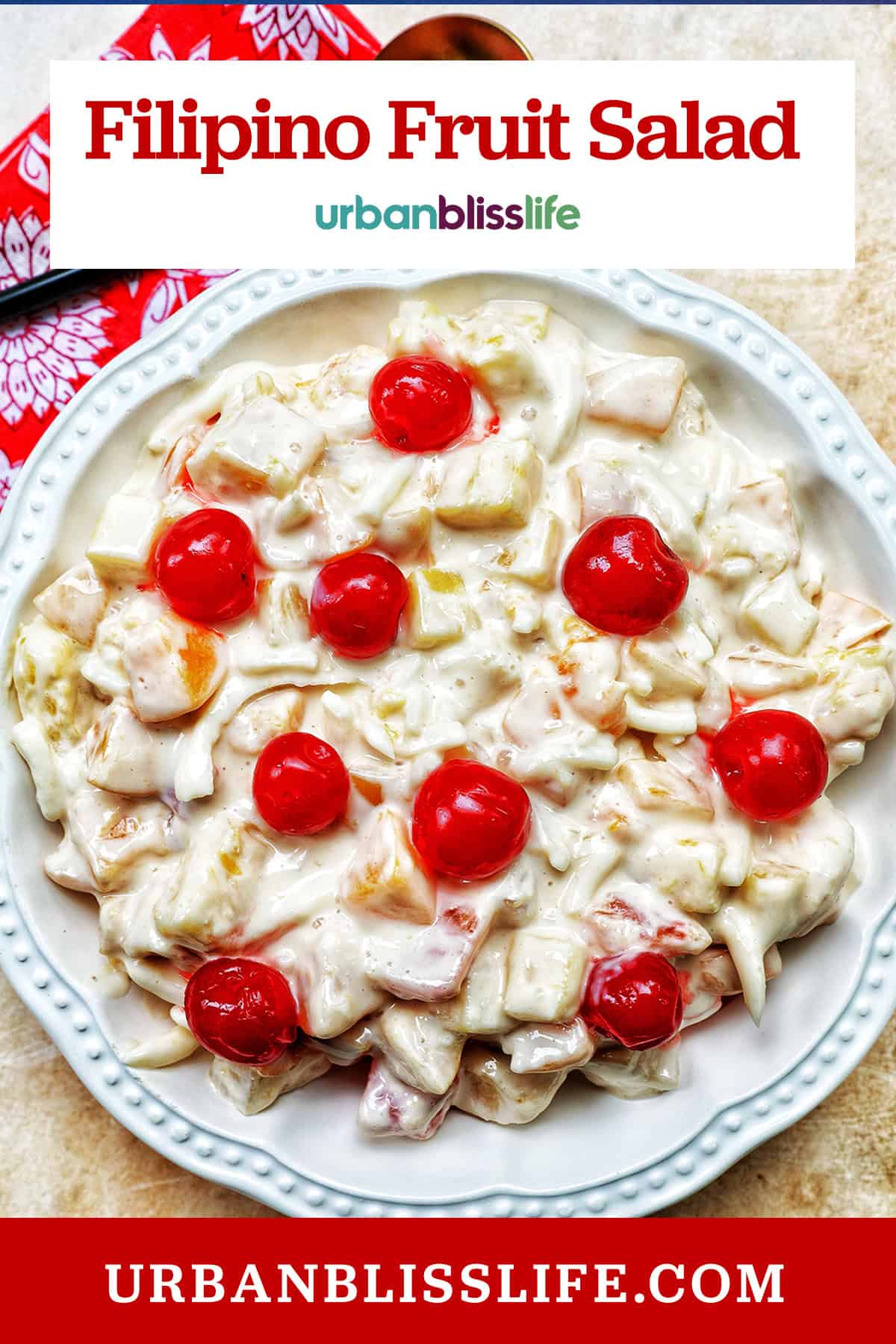 bowl of Filipino Fruit Salad topped with maraschino cherries with title text overlay.