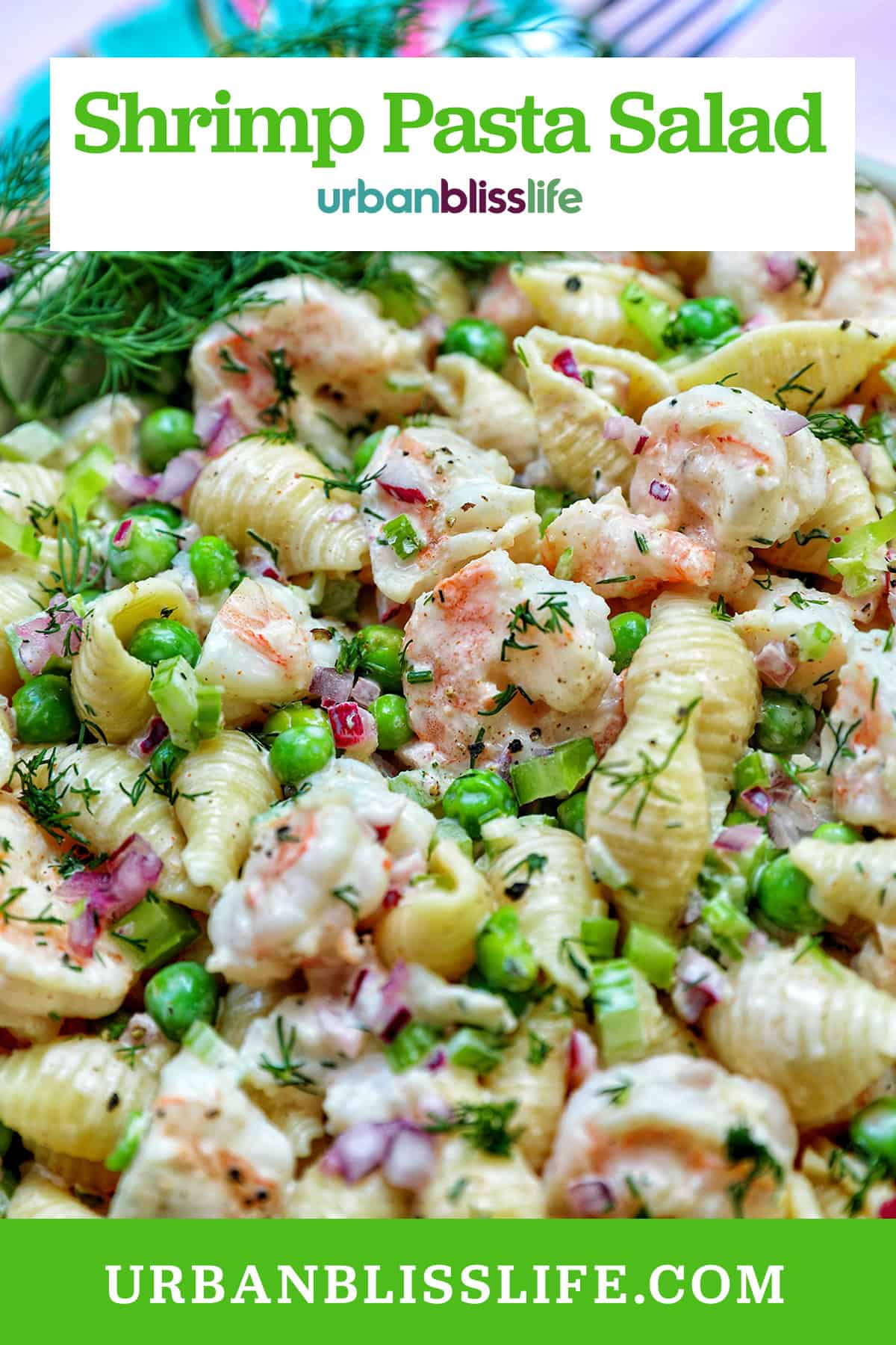 bowl of shrimp pasta salad with title text overlay.