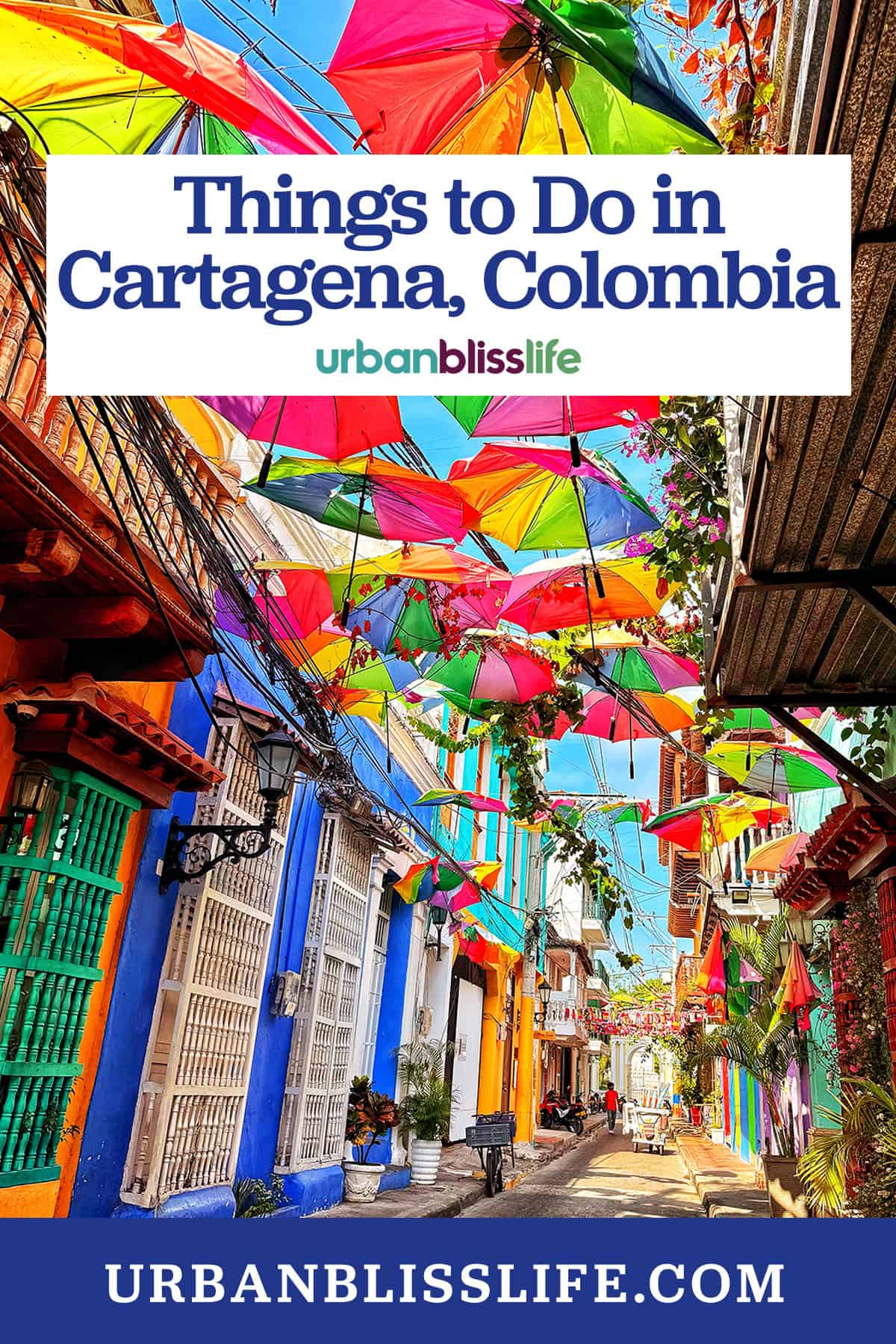 colorful umbrella street in Cartagena, Colombia with title text overlay.