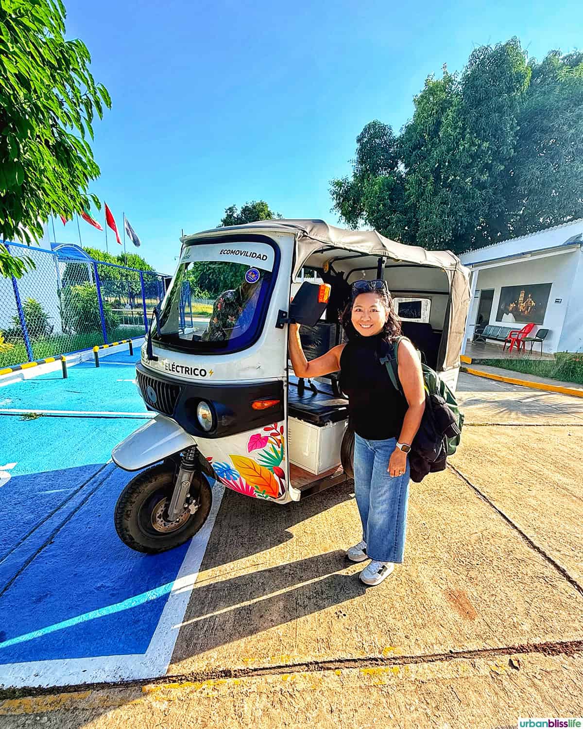 Marlynn next to a Tuk-Tuk in Santa Cruz de Mompox, Colombia.