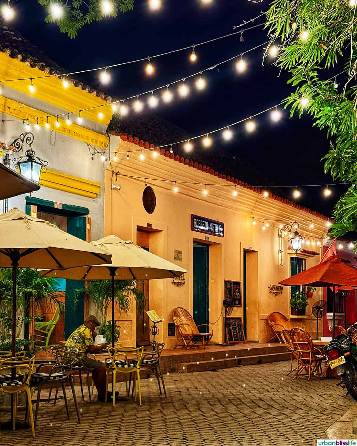 string light-lined street at night in Santa Cruz de Mompox, Colombia.