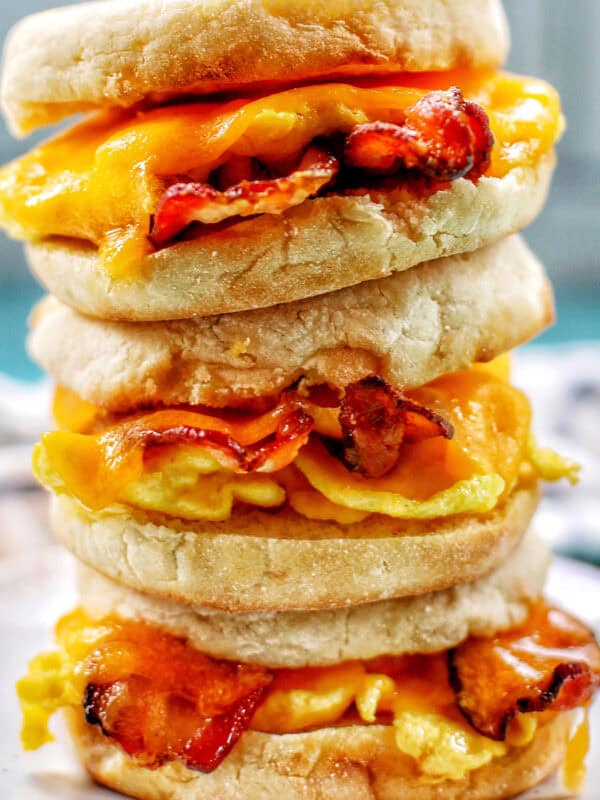 stack of three air fryer breakfast sandwiches on a plate.