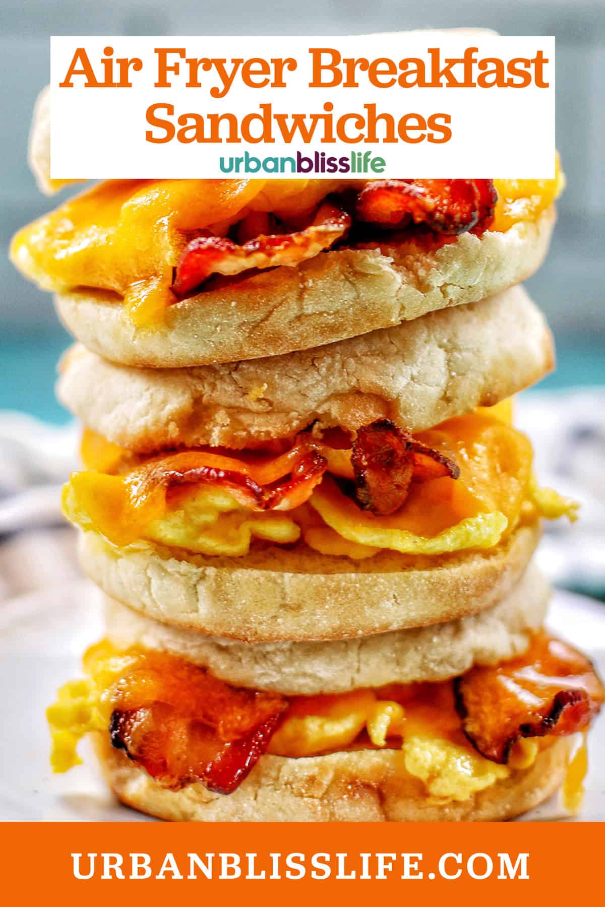 stack of three air fryer breakfast sandwiches on a plate with title text overlay.