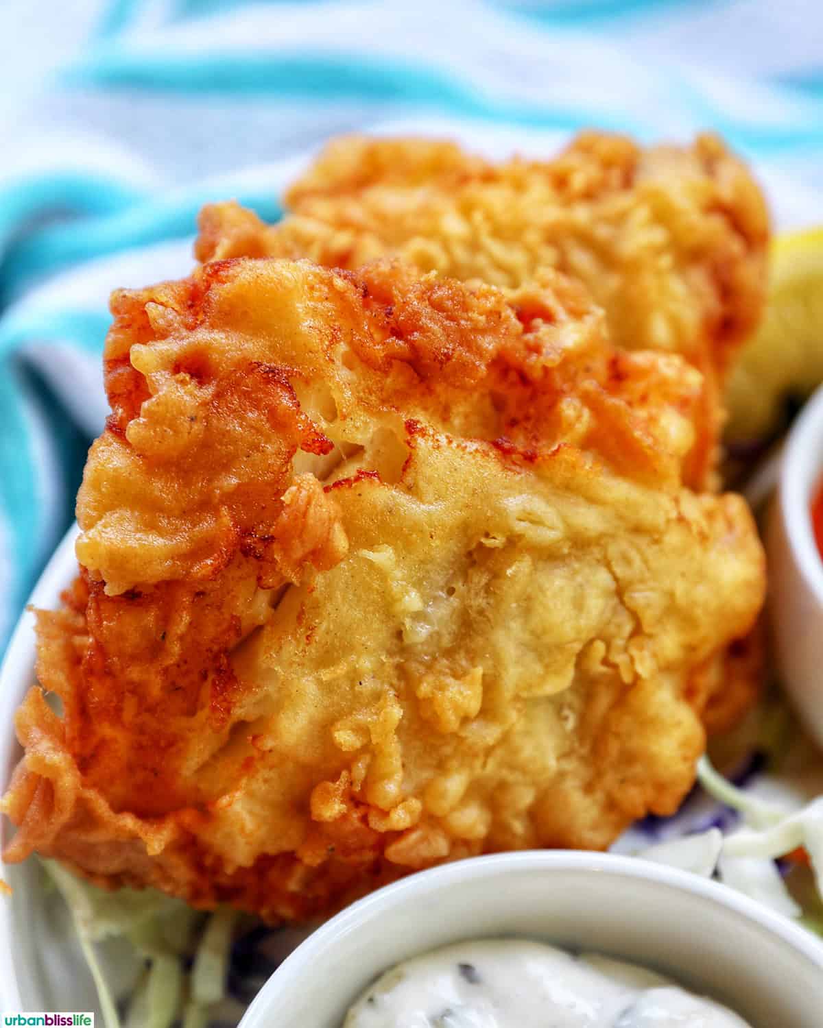 air fryer cod pieces on a plate.
