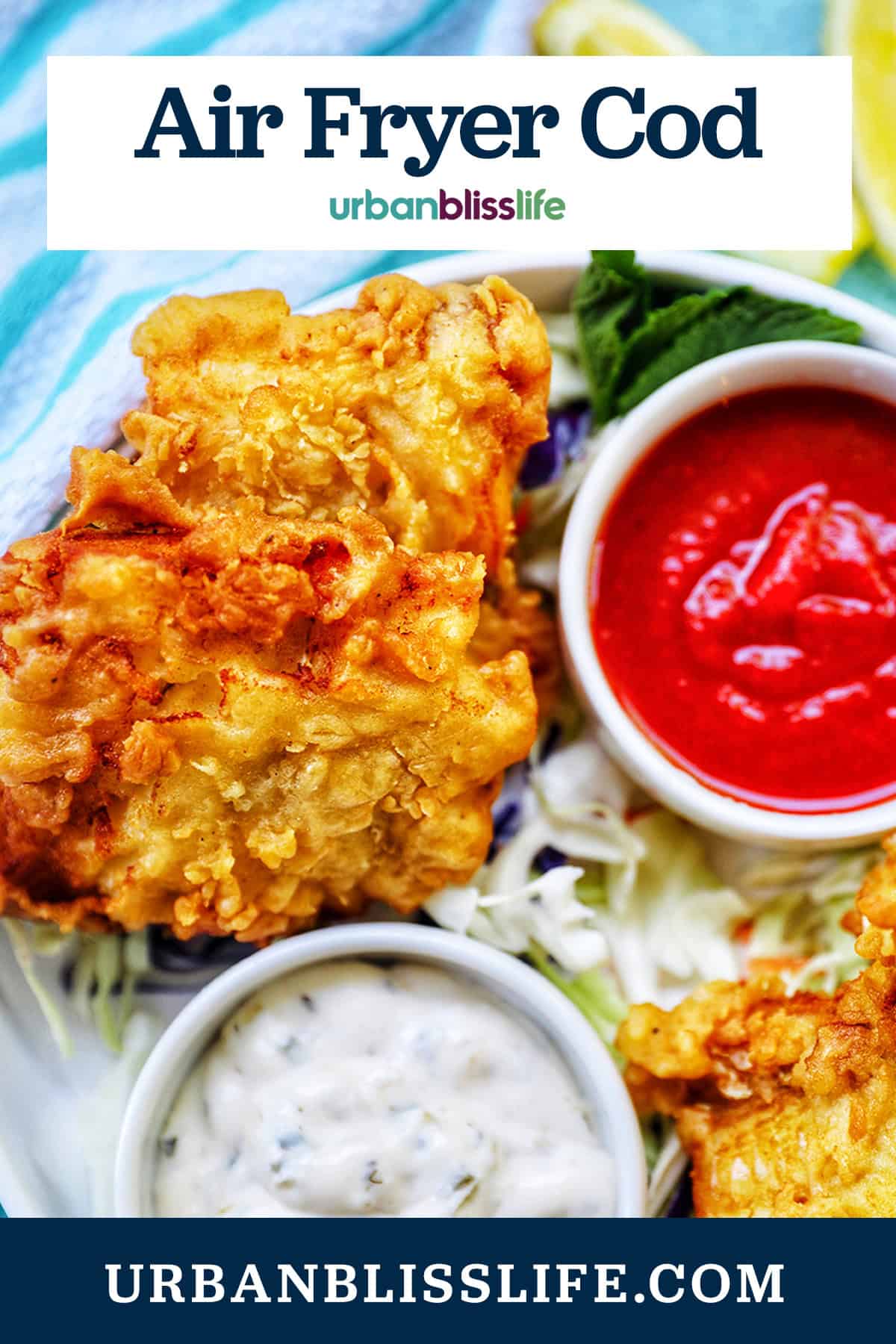 air fryer cod pieces on a plate with sides of tartar sauce, coleslaw, and cocktail sauce with title text overlay.