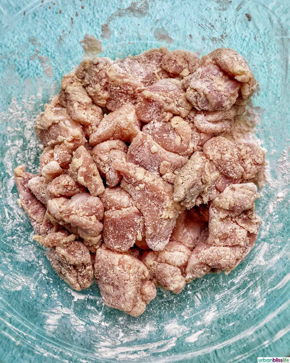 air fryer teriyaki chicken in a bowl ready to be cooked.
