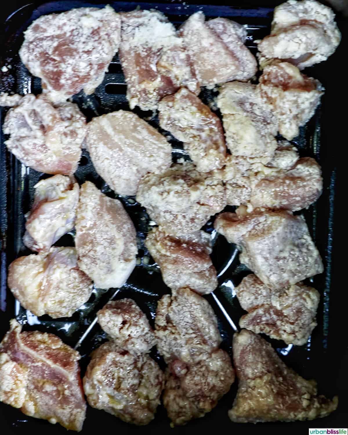 air fryer teriyaki chicken in an air fryer basket.