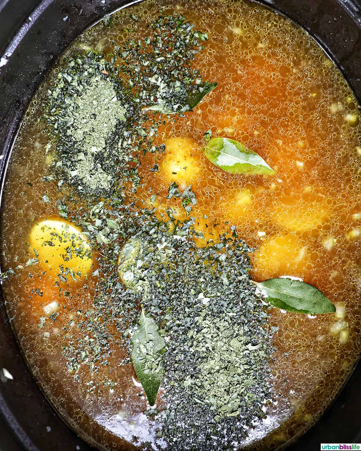 Colombian ajiaco soup cooking in a dutch oven.