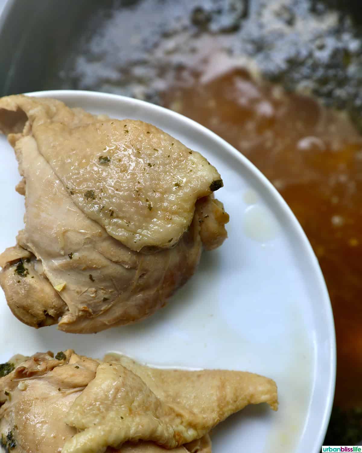 cooked chicken transferred to a plate.