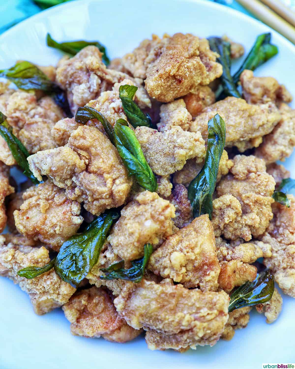 bowl of Taiwanese popcorn chicken with fried basil.