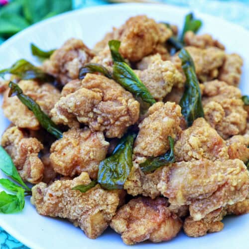 bowl of Taiwanese popcorn chicken with fried basil.