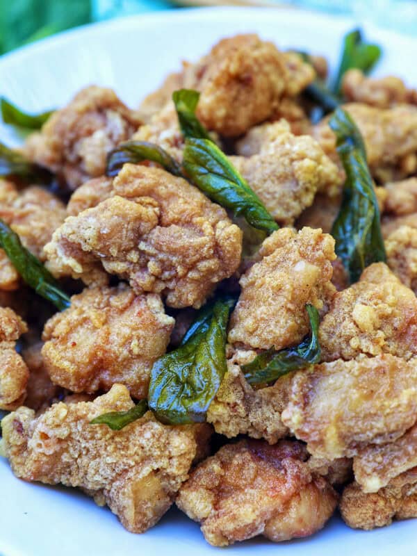 bowl of Taiwanese popcorn chicken with fried basil.