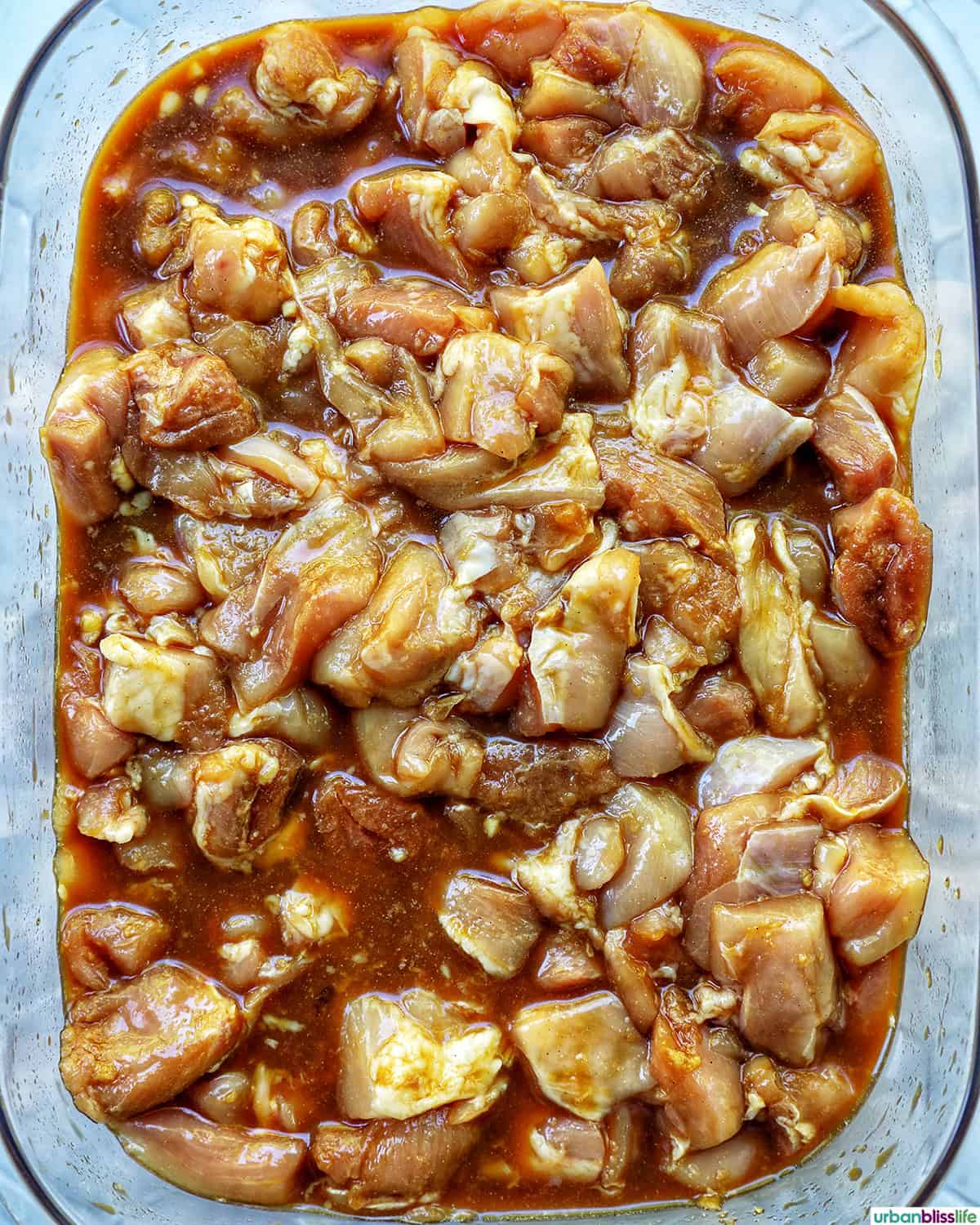 Taiwanese popcorn chicken marinating in a container.