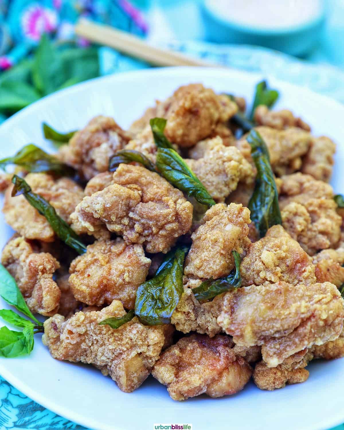 bowl of Taiwanese popcorn chicken with fried basil.