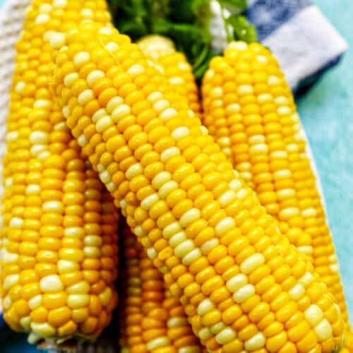stack of corn on the cobs.