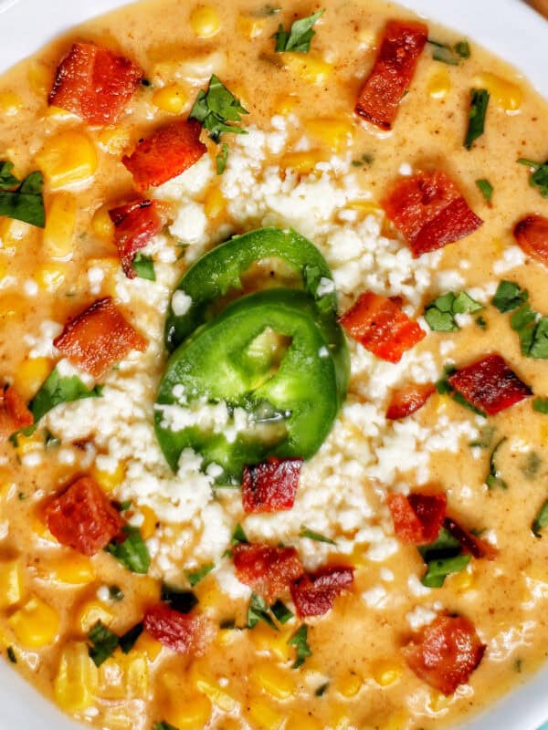 bowl of Instant Pot Mexican Street Corn Chowder with bacon, jalapenos, and Cotija cheese.