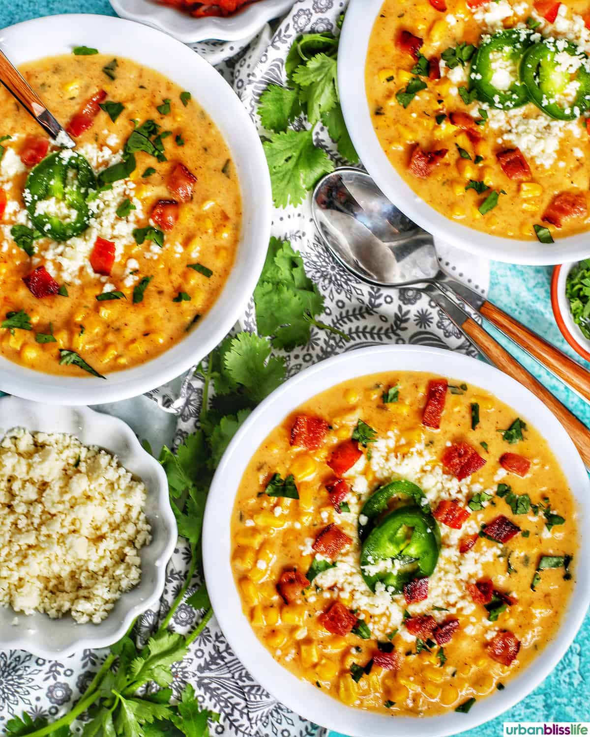 bowls of Instant Pot Mexican Street Corn Chowder with bacon, jalapenos, and Cotija cheese.