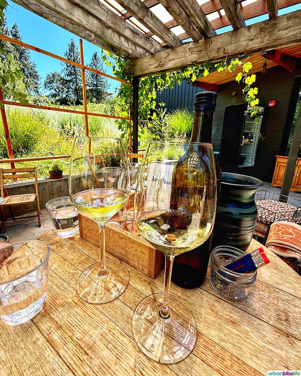 white wine glasses at Idiot's Grace Winery in Mosier, Oregon.