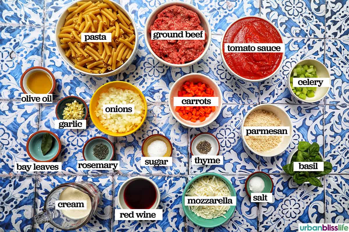 bowls of ingredients meat added to celery, carrots, onions, garlic to make baked pasta bolognese.