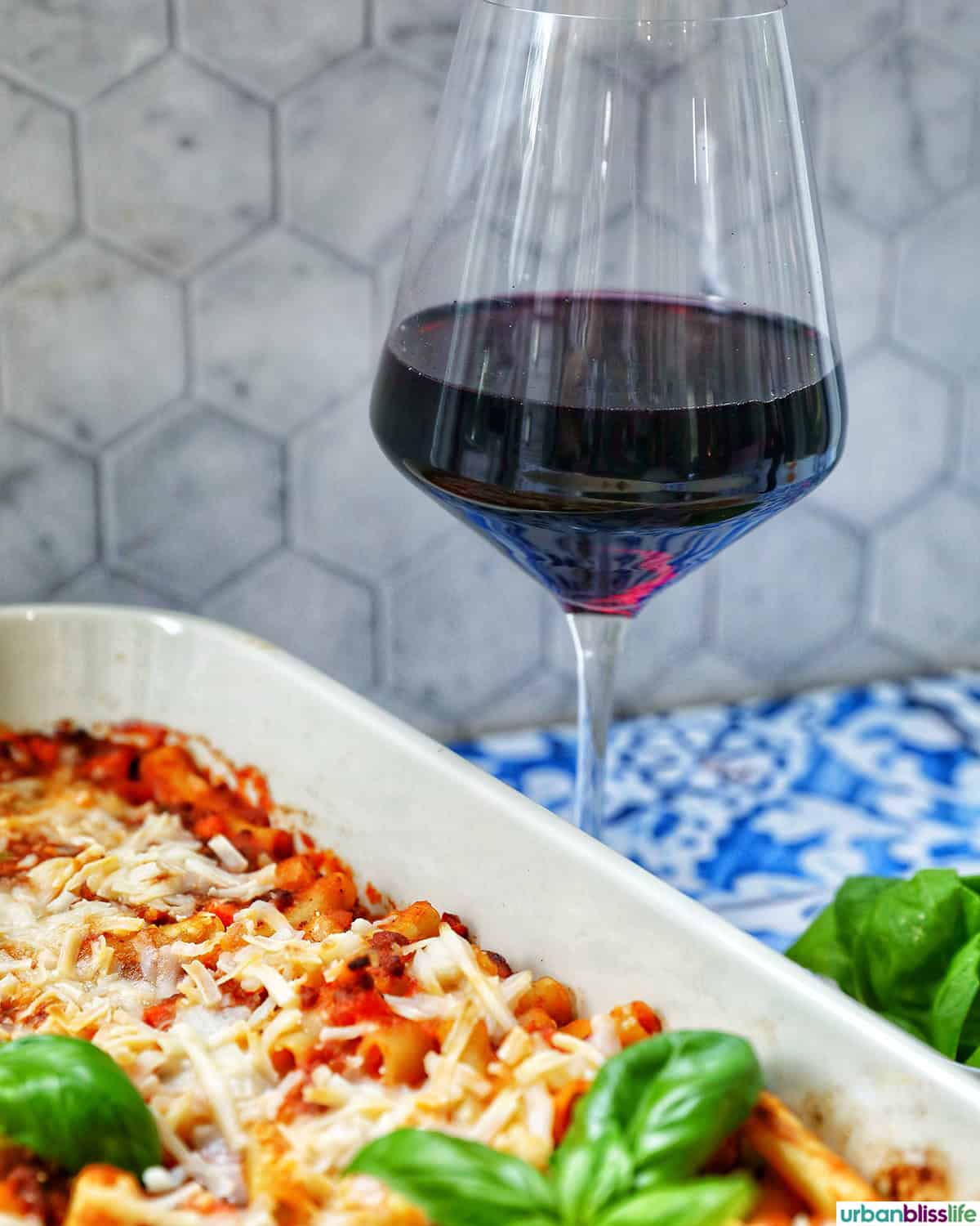 red wine with baked pasta bolognese.
