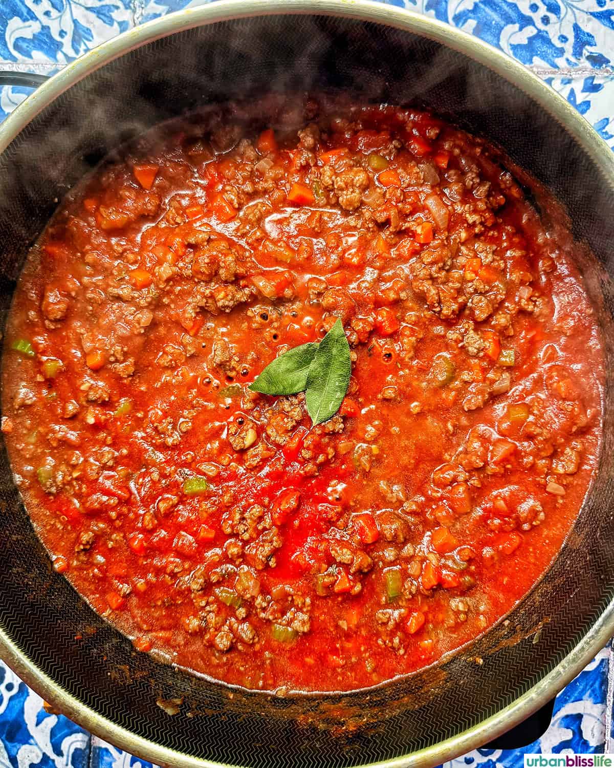 bay leaves added to sauce to make baked pasta bolognese.