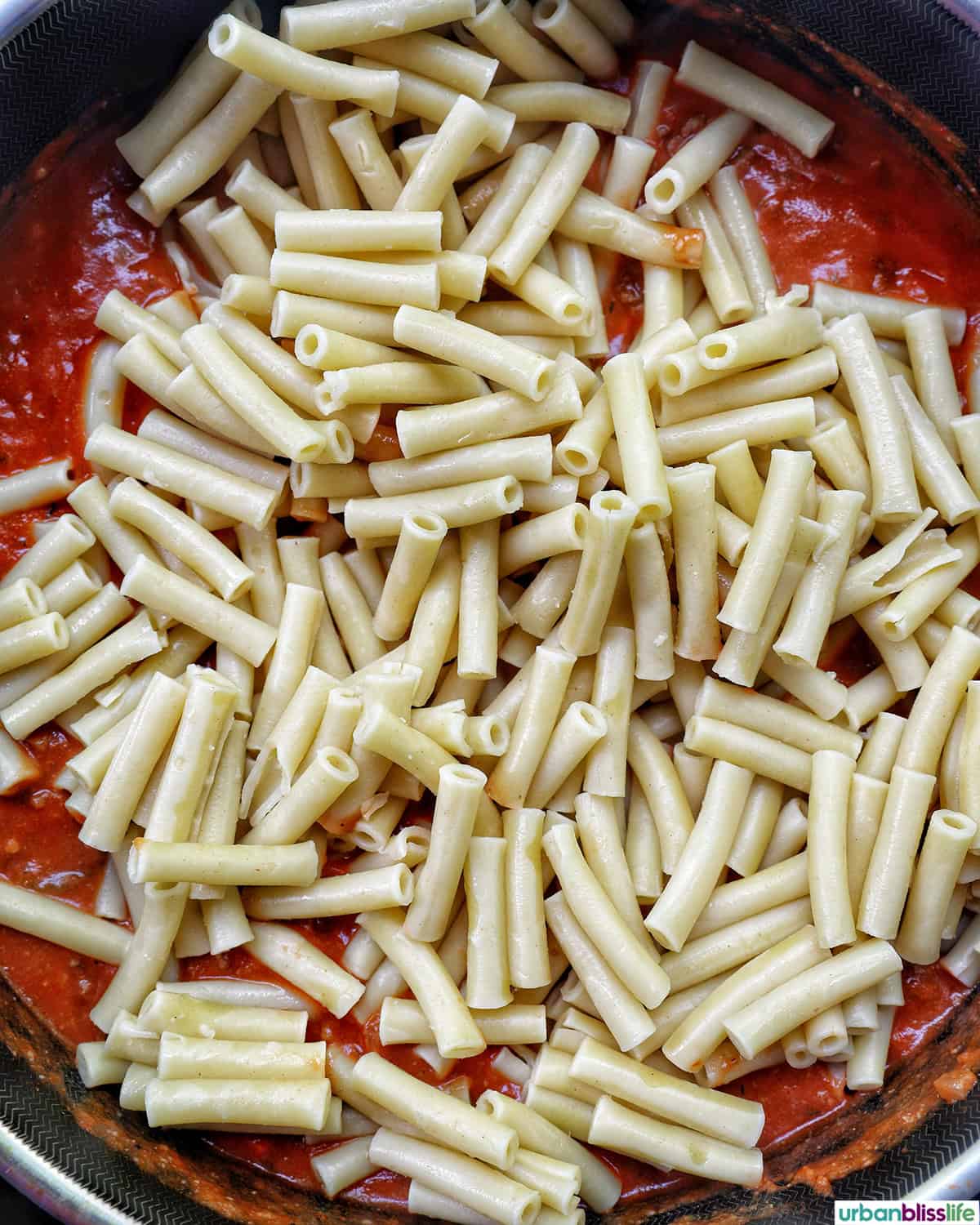 ziti pasta added to make baked pasta bolognese.
