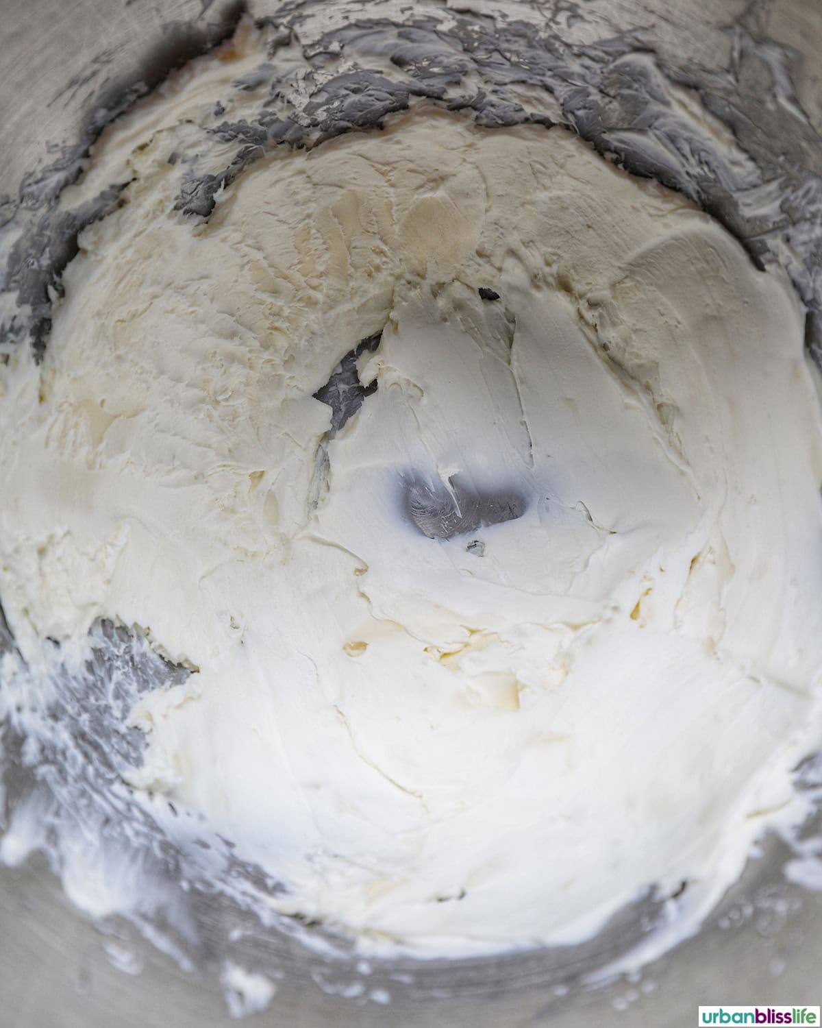 coffee cream cheese frosting in a stand mixer bowl.