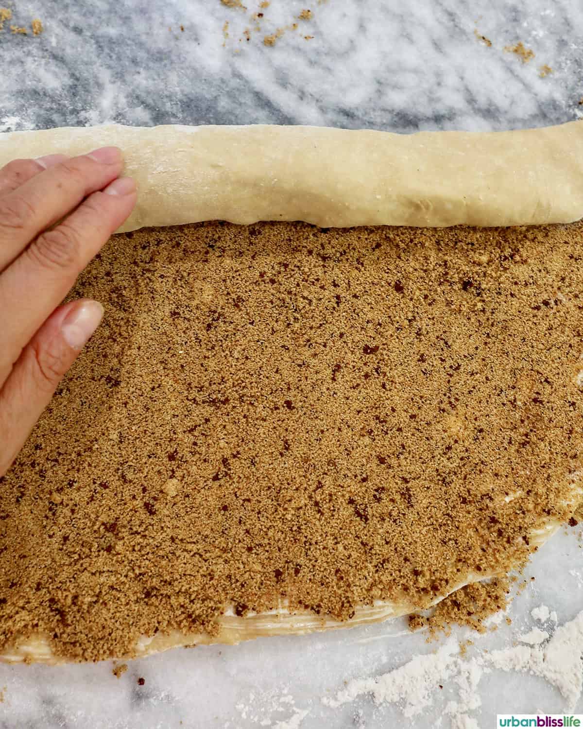 rolling dough to make coffee cinnamon rolls.