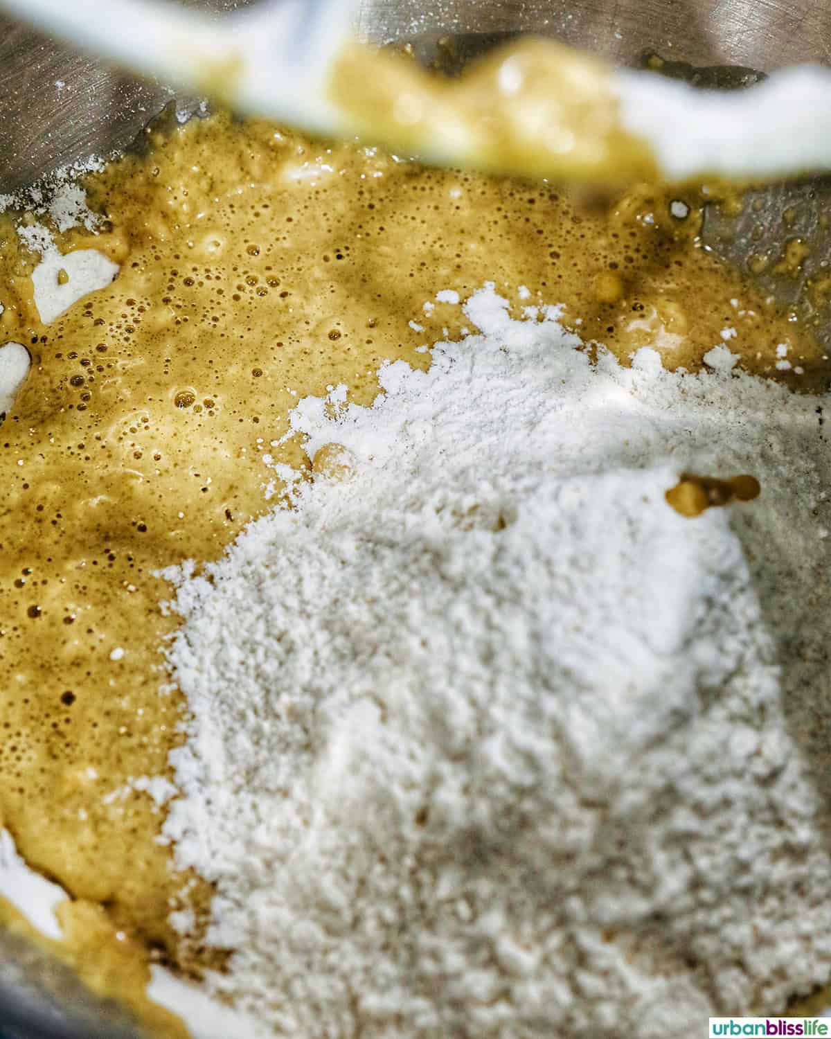 dry ingredients added to wet ingredients to make coffee cinnamon rolls.