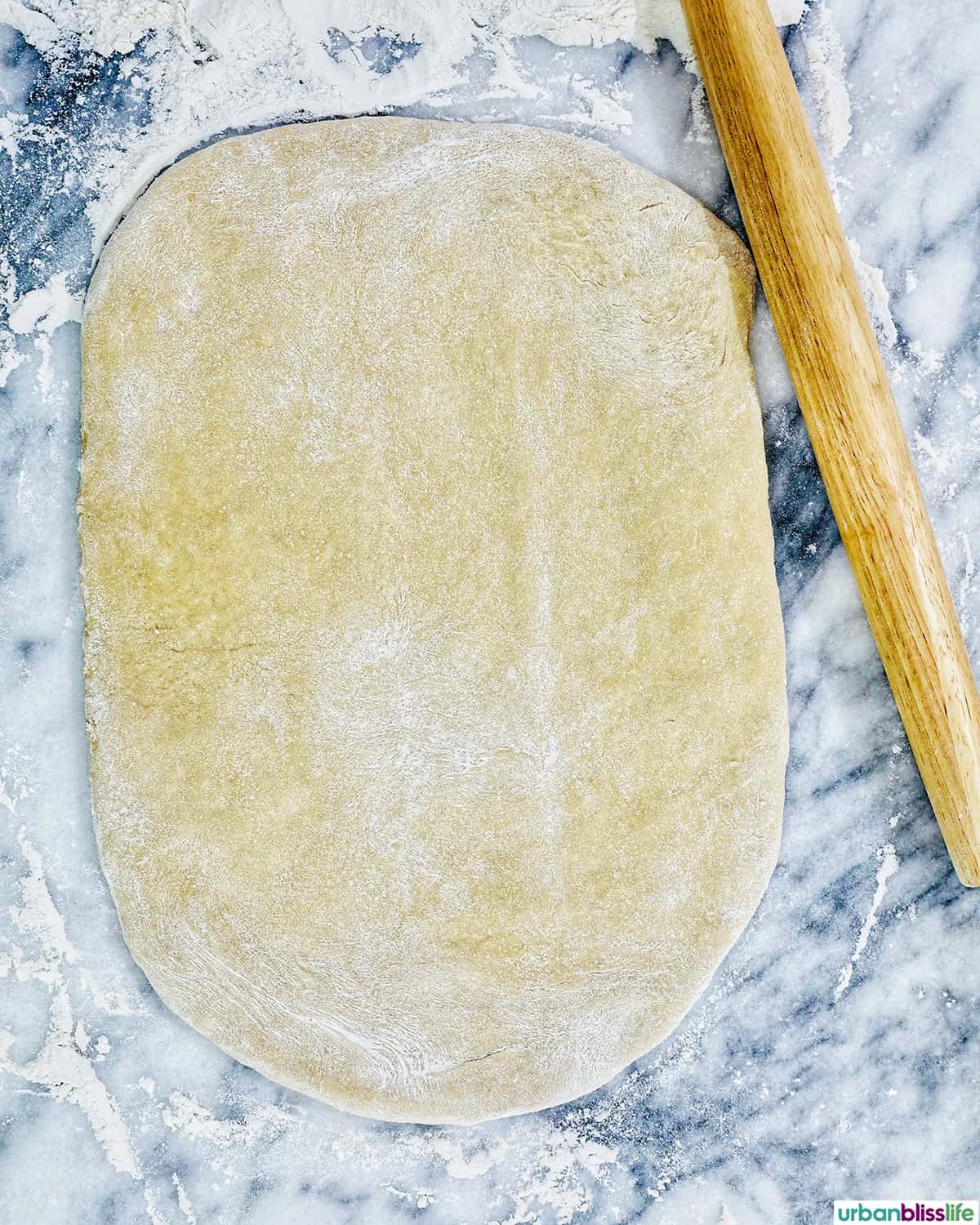 rolling out the dough to make coffee cinnamon rolls.