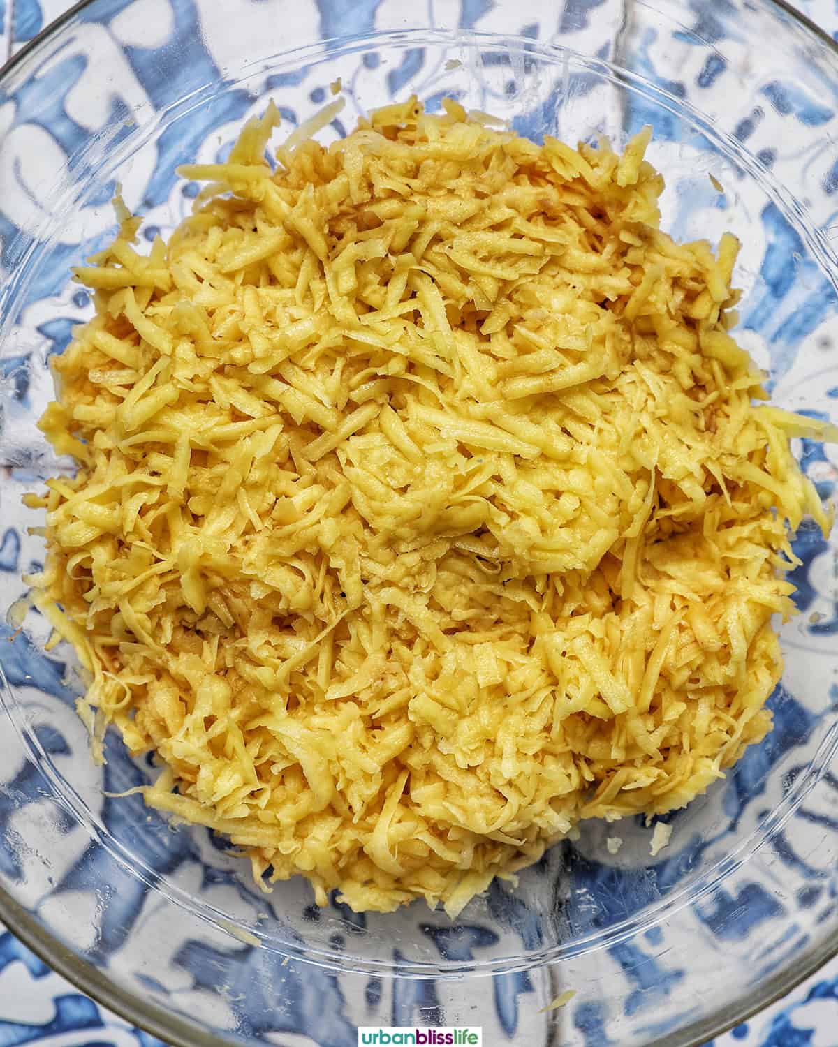 bowl of grated potatoes to make Swiss rosti.