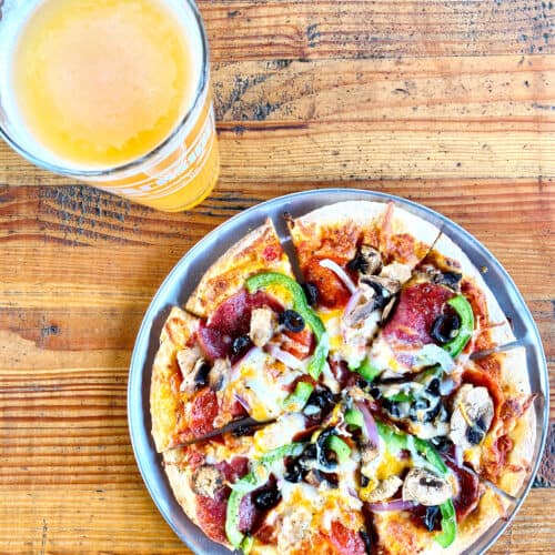 glass of beer with pizza