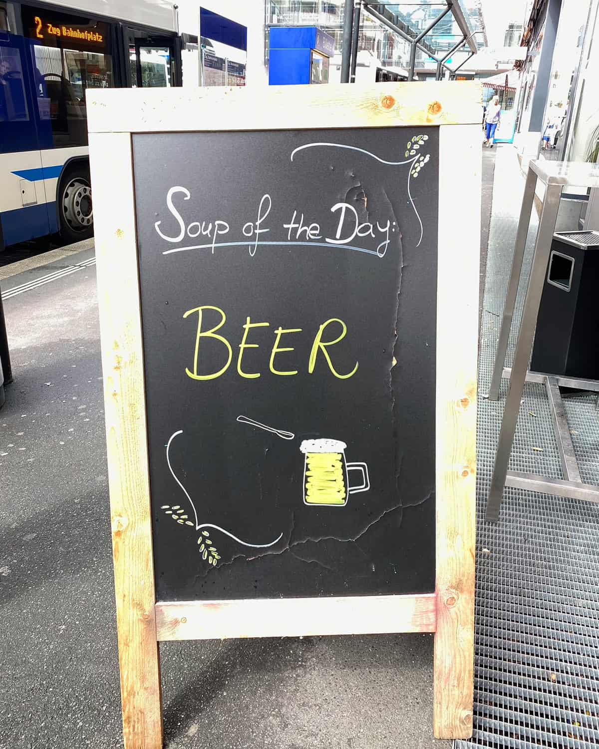 sign that reads soup of the day beer