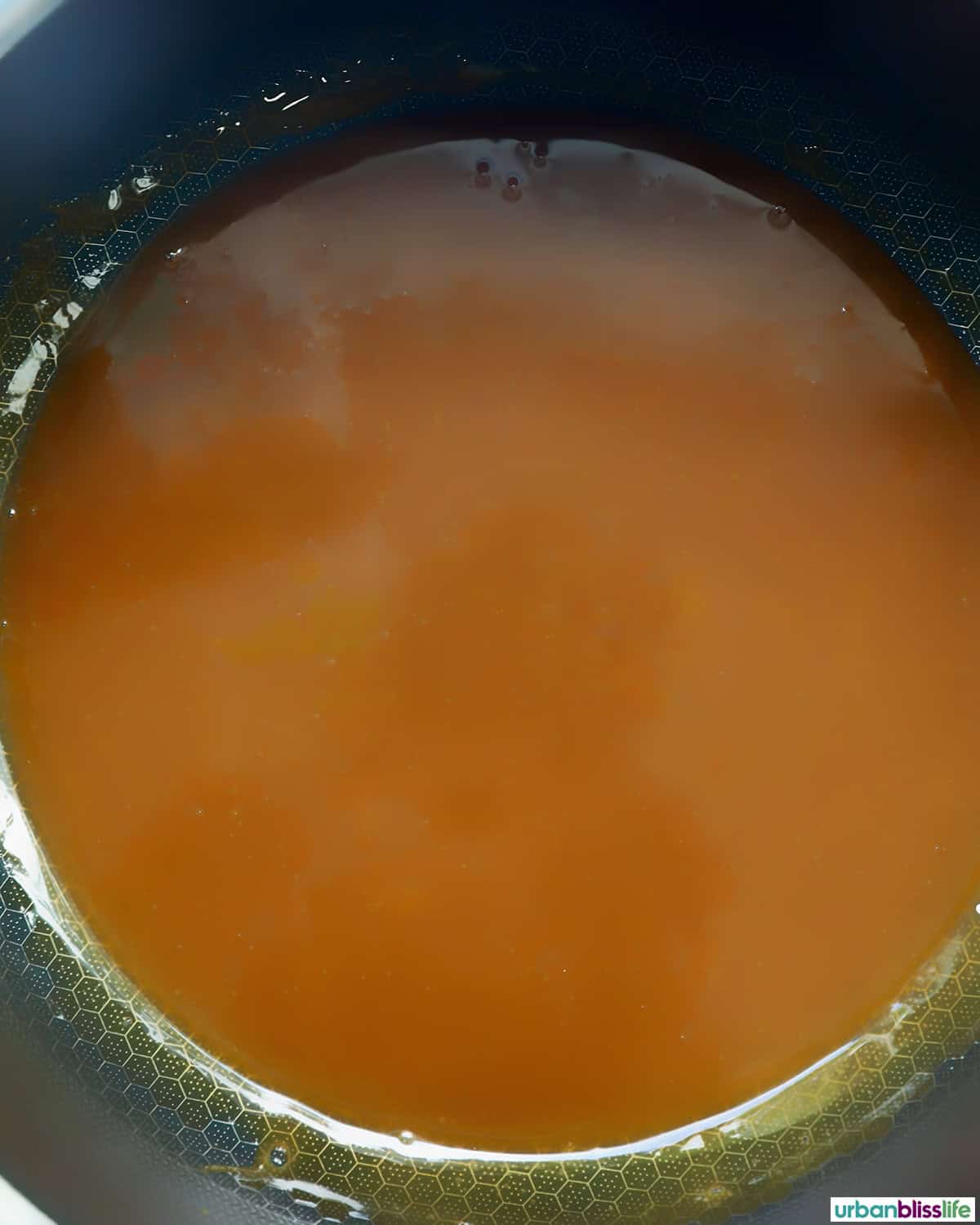 caramel in a pot on the stove.