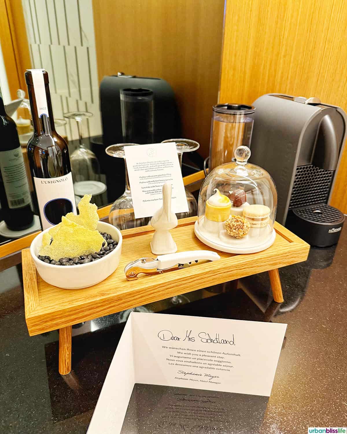 welcome wine, welcome letter, and treats at Hotel Storchen Zürich.